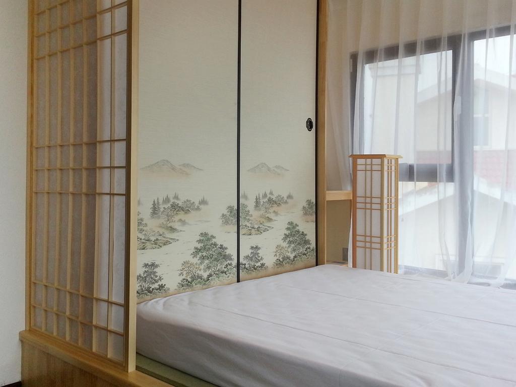 Villa Inn No.21 Seaside Qingdao Chambre photo